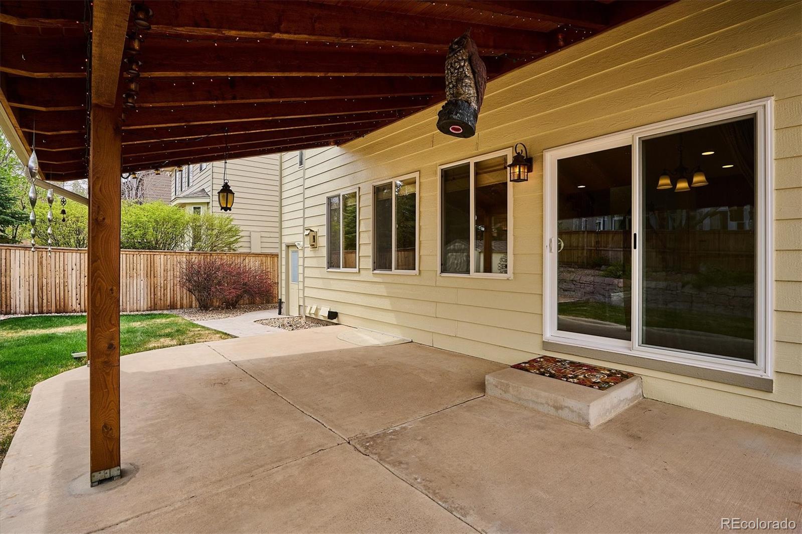 6299 Shannon Trail Highlands Ranch, CO 80130 - Photo 37 of 40 a view of a house with backyard and porch