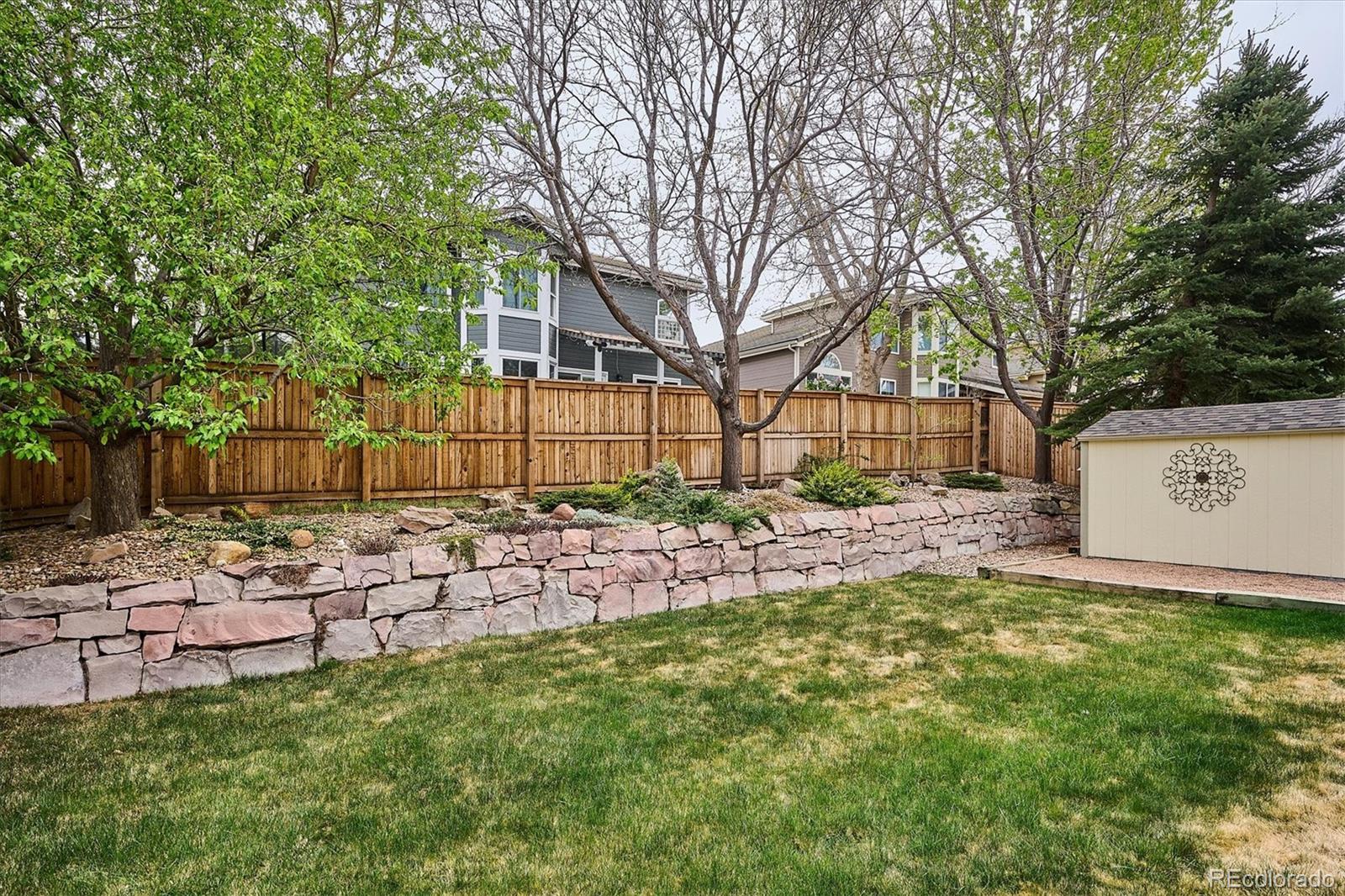 6299 Shannon Trail Highlands Ranch, CO 80130 - Photo 40 of 40 a view of a house with a yard