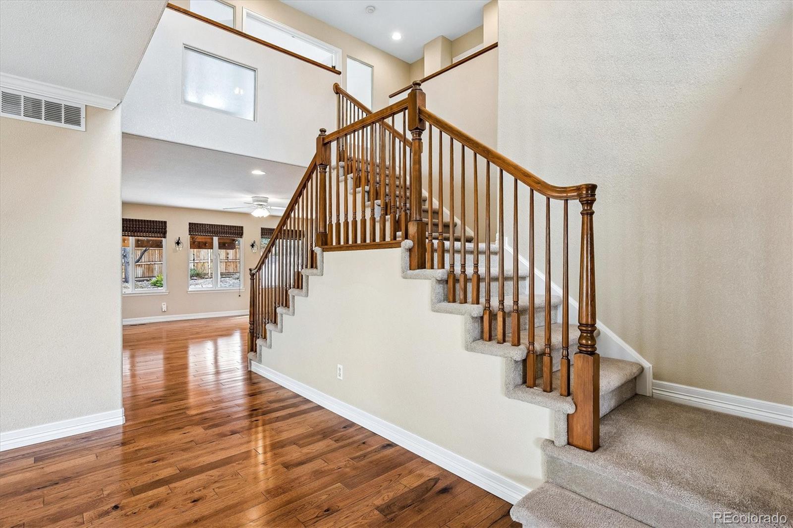 6299 Shannon Trail Highlands Ranch, CO 80130 - Photo 7 of 40 a view of entryway and hall with wooden floor