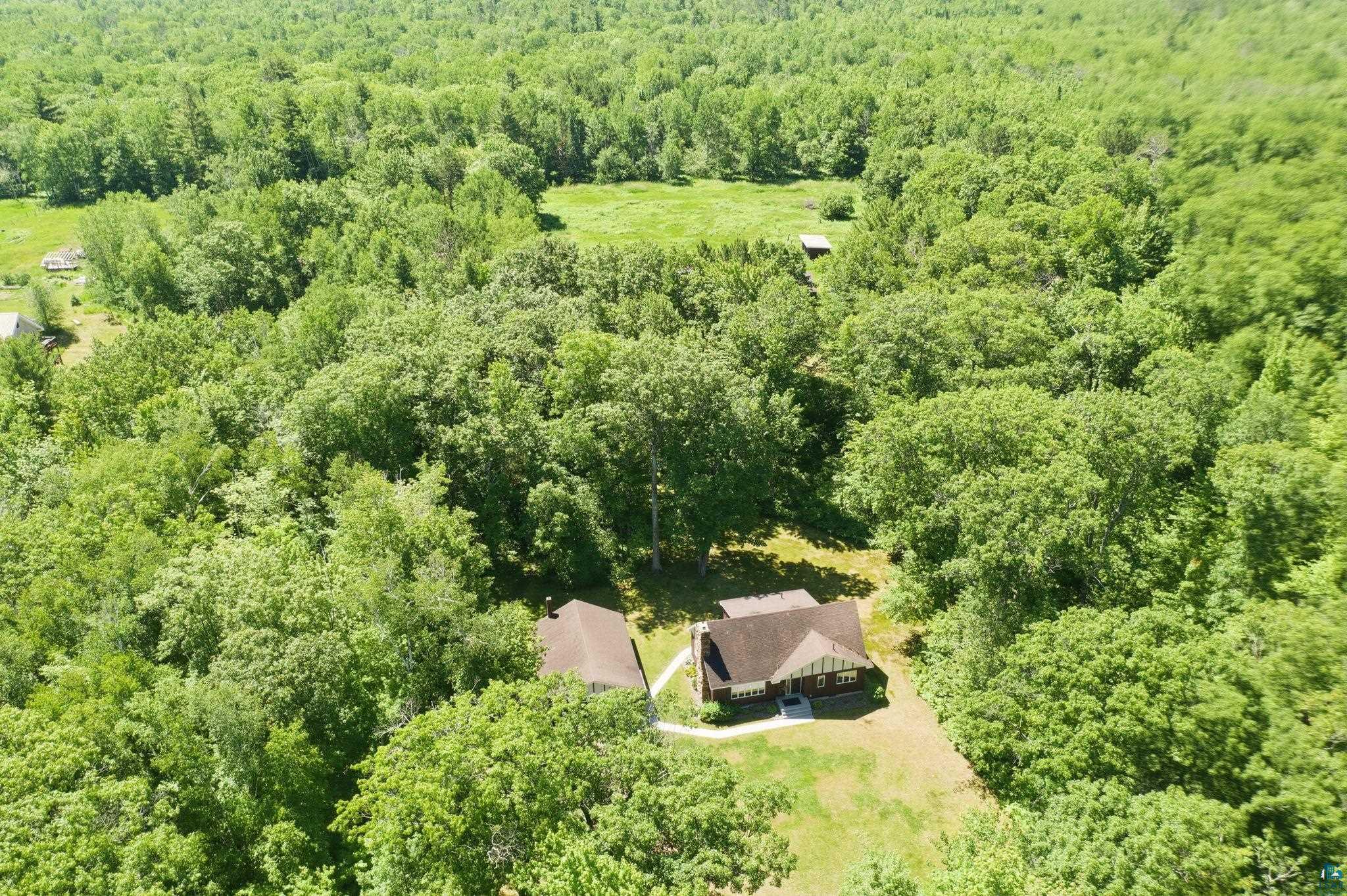 27485 South Kane Road Ashland, WI 54806 - Photo 35 of 35 Expansive property featuring a residence surrounded by dense mature trees and open green spaces