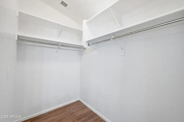 a view of an empty walk in closet