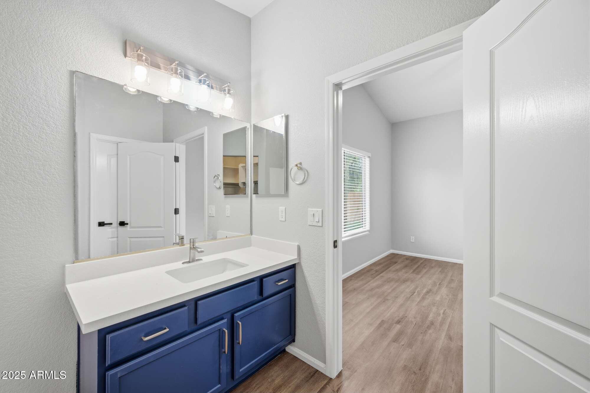 4128 East Copper Road San Tan Valley, AZ 85143 - Photo 16 of 27 a bathroom with a sink double vanity and a mirror