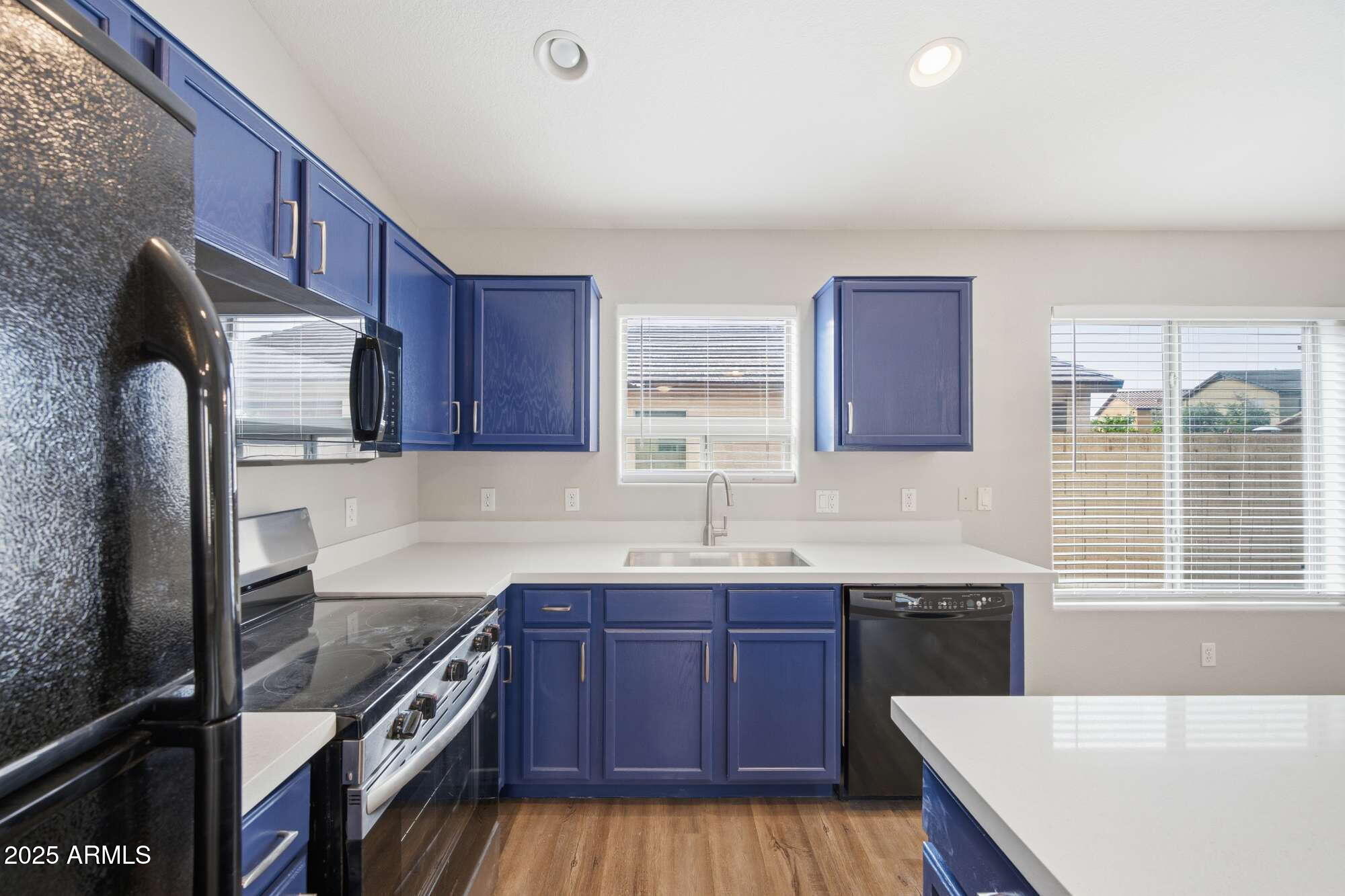 4128 East Copper Road San Tan Valley, AZ 85143 - Photo 10 of 27 a kitchen with stainless steel appliances granite countertop a sink stove and refrigerator