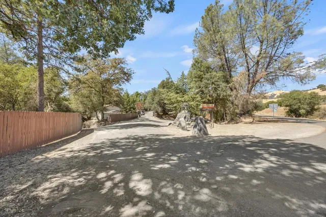 a kitchen with granite countertop a sink cabinets and window