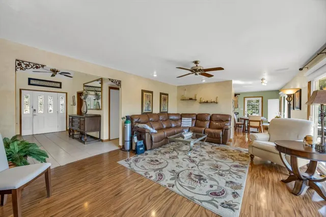 a white bath tub sitting in a bathroom next to a window