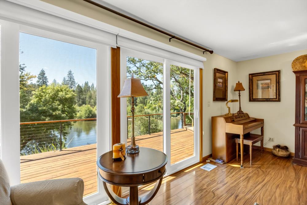 6400 State Highway Lotus, CA 95651 - Photo 26 of 95 a living room with a large window and furniture