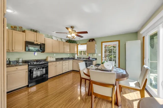 a view of a chairs and table on the balcony