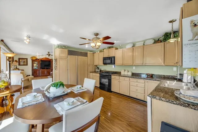 a yellow house with trees in front of it
