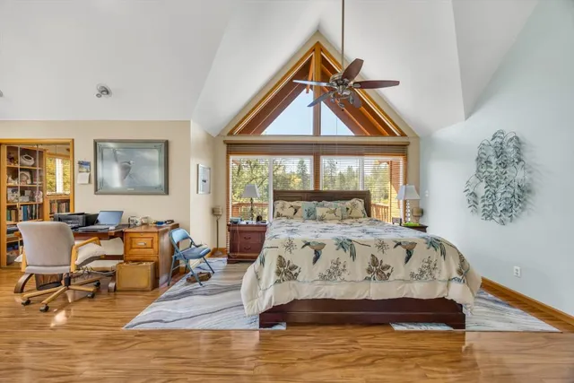 a view of a yard with wooden fence