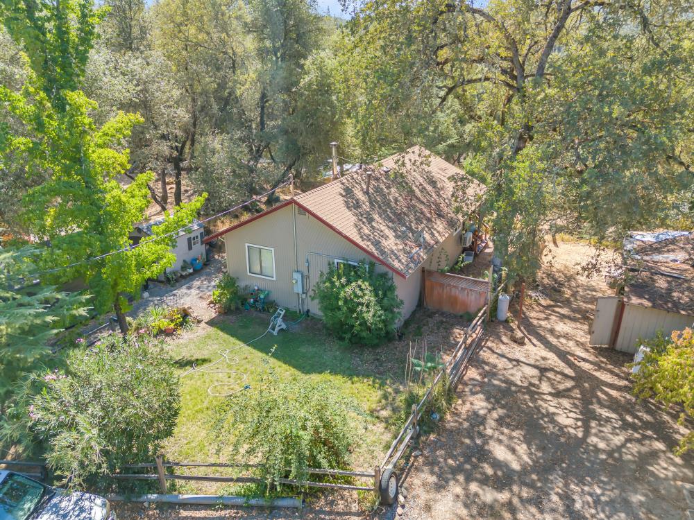 6400 State Highway Lotus, CA 95651 - Photo 57 of 95 a view of a house with a yard and plant