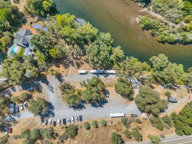 a living room with furniture and large windows