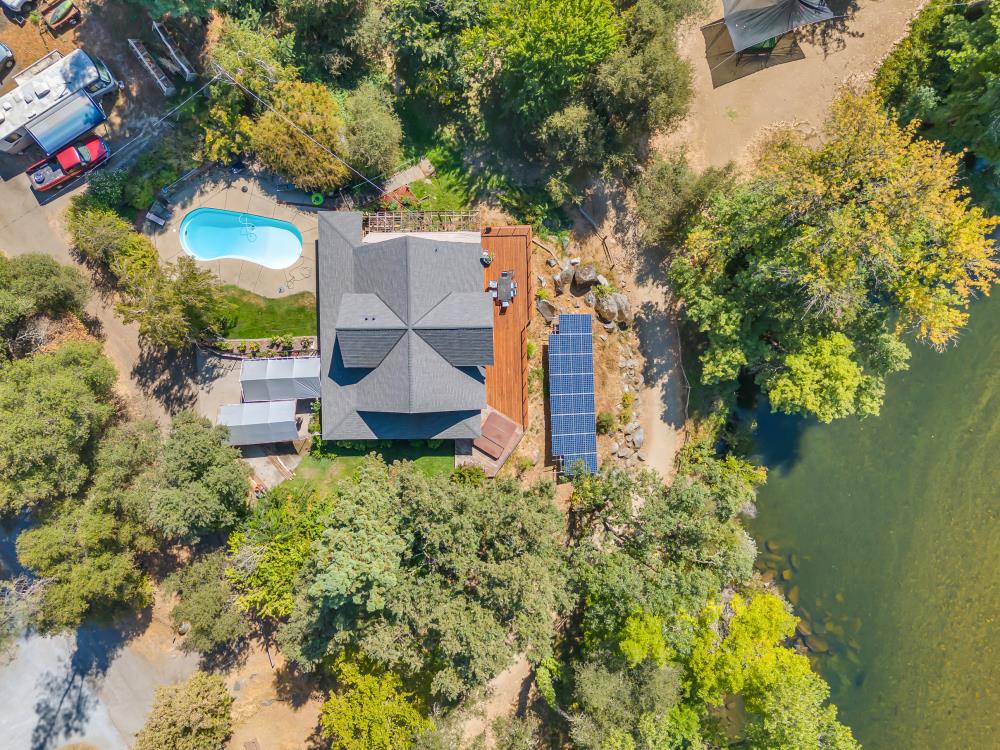 6400 State Highway Lotus, CA 95651 - Photo 76 of 95 an aerial view of a house with swimming pool and garden