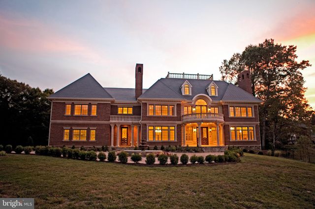 a front view of a residential apartment building with a yard