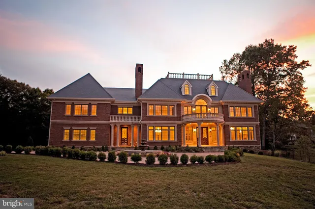 a front view of a residential apartment building with a yard