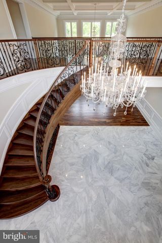 a spacious bathroom with a granite countertop sink and a mirror