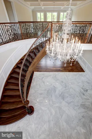 a spacious bathroom with a granite countertop sink and a mirror