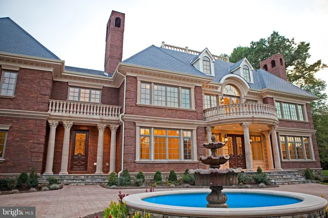 a view of entryway and hall with a front door