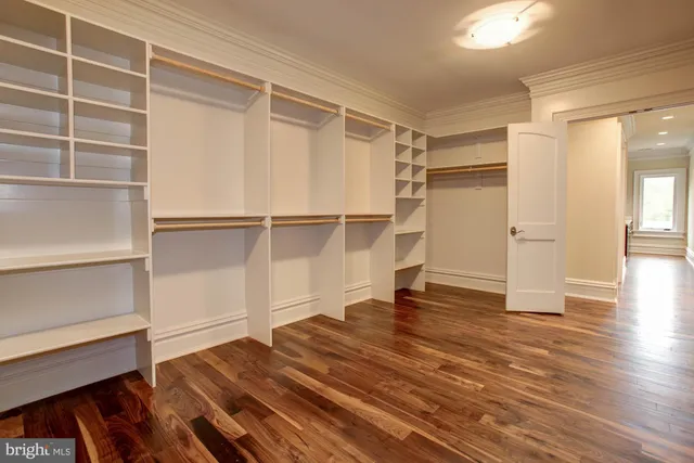 a view of an empty room with a fireplace