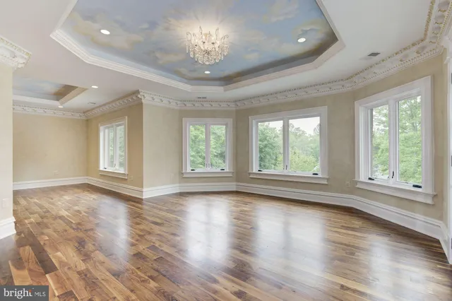 a view of a kitchen with a sink and a refrigerator