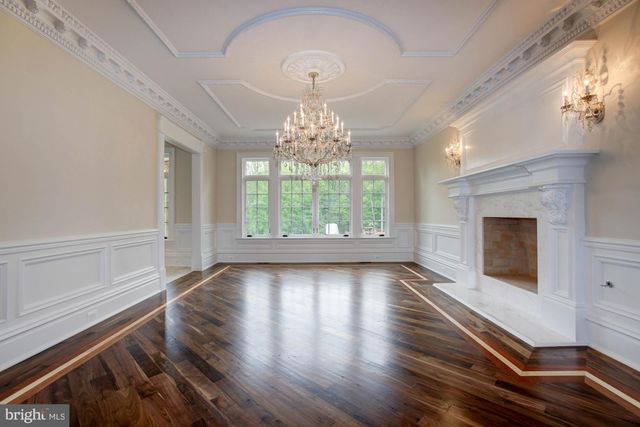 a kitchen with stainless steel appliances a stove a sink and a refrigerator