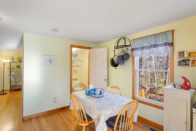 a view of kitchen island with furniture and wooden floor