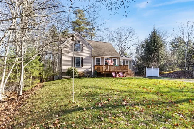 a house is sitting in middle of yard