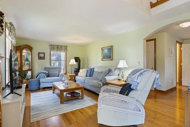 a living room with furniture or couch and a wooden floor