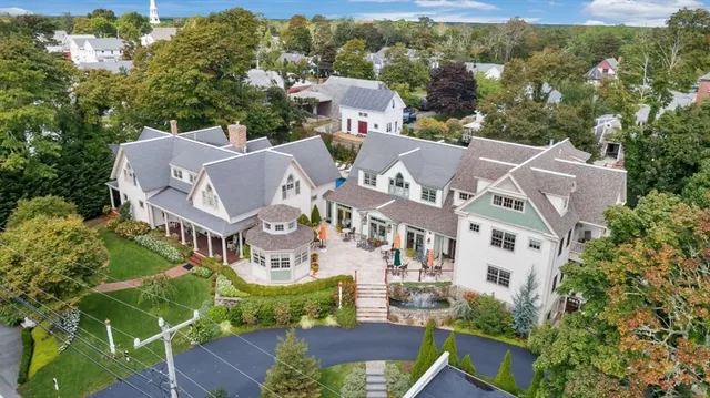 an aerial view of multiple houses with yard