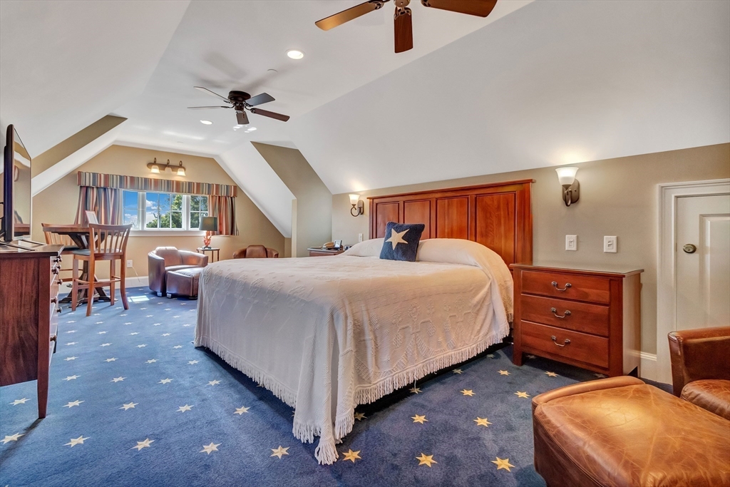 116 Parallel Street Harwich, MA 02645 - Photo 16 of 21 a spacious bedroom with a bed and a chandelier