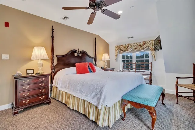 a bed room with a bed and a chandelier