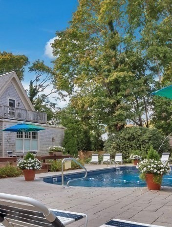116 Parallel Street Harwich, MA 02645 - Photo 8 of 21 a view of backyard with outdoor seating and plants