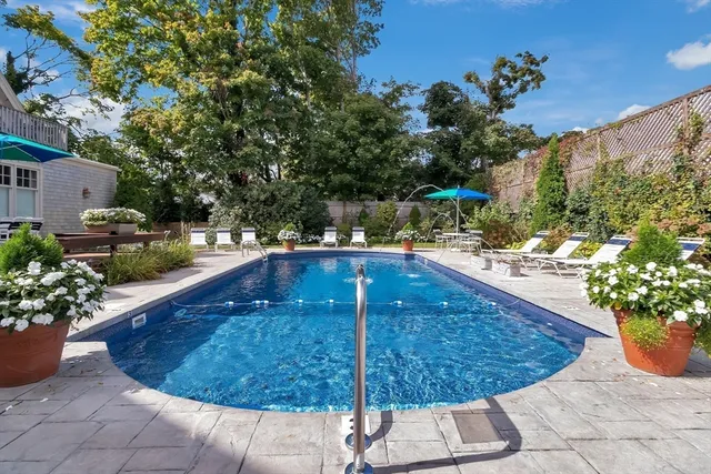 a view of a swimming pool with a patio
