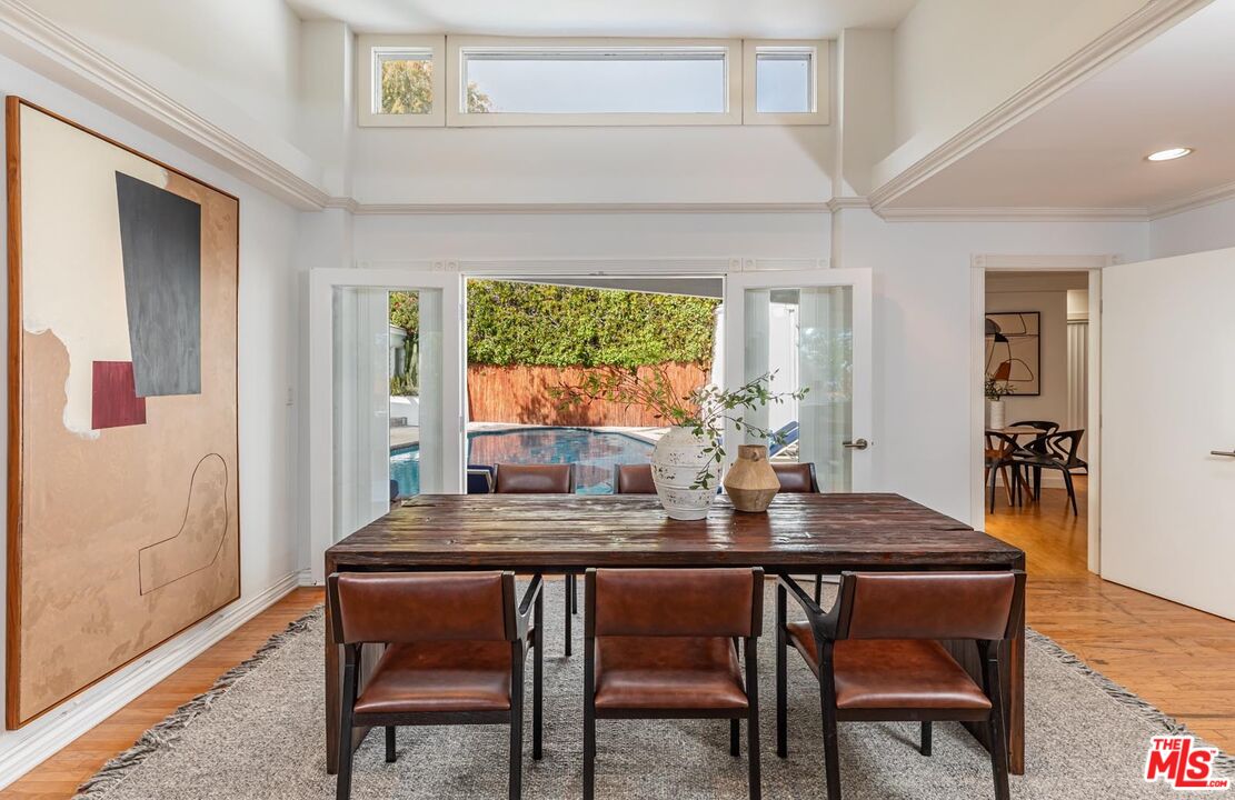 1501 Rising Glen Road Los Angeles, CA 90069 - Photo 3 of 17 a dining room with furniture and window