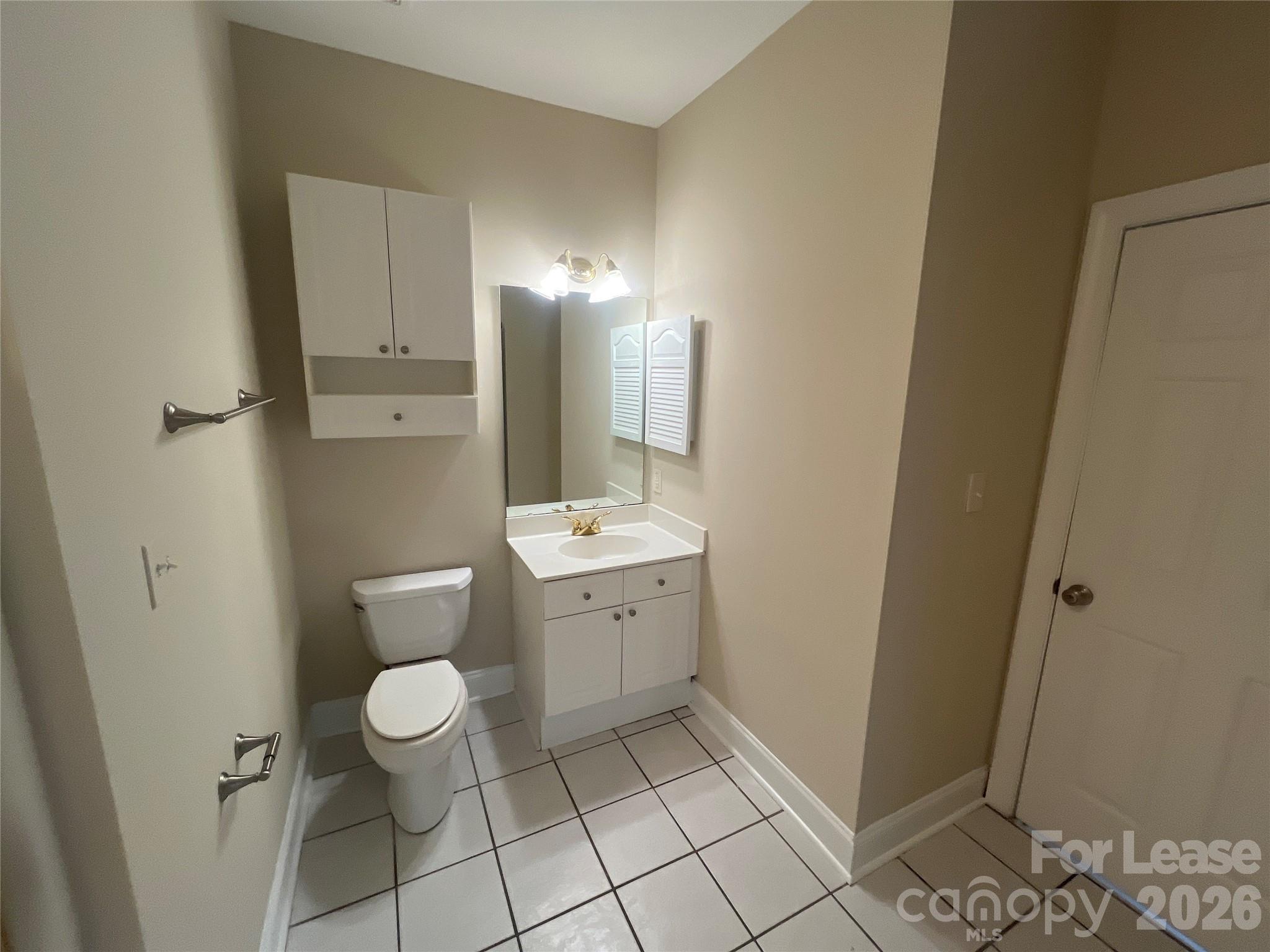 8913 Meadow Vista Road Charlotte, NC 28213 - Photo 11 of 17 a bathroom with a sink toilet and shower