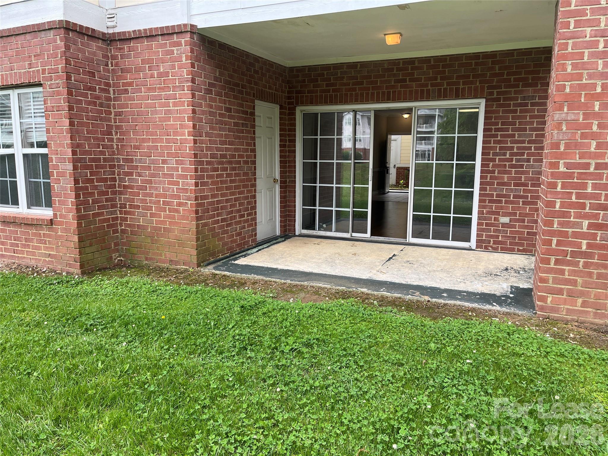 8913 Meadow Vista Road Charlotte, NC 28213 - Photo 14 of 17 a front view of a house with a garden
