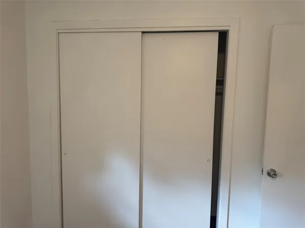 a bathroom with a glass shower door