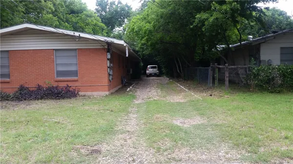 a backyard of a house with lots of green space