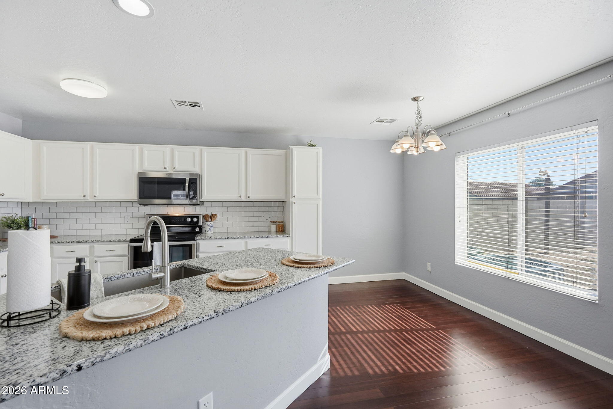 1707 West Harding Avenue Coolidge, AZ 85128 - Photo 12 of 53 a kitchen with sink refrigerator and microwave