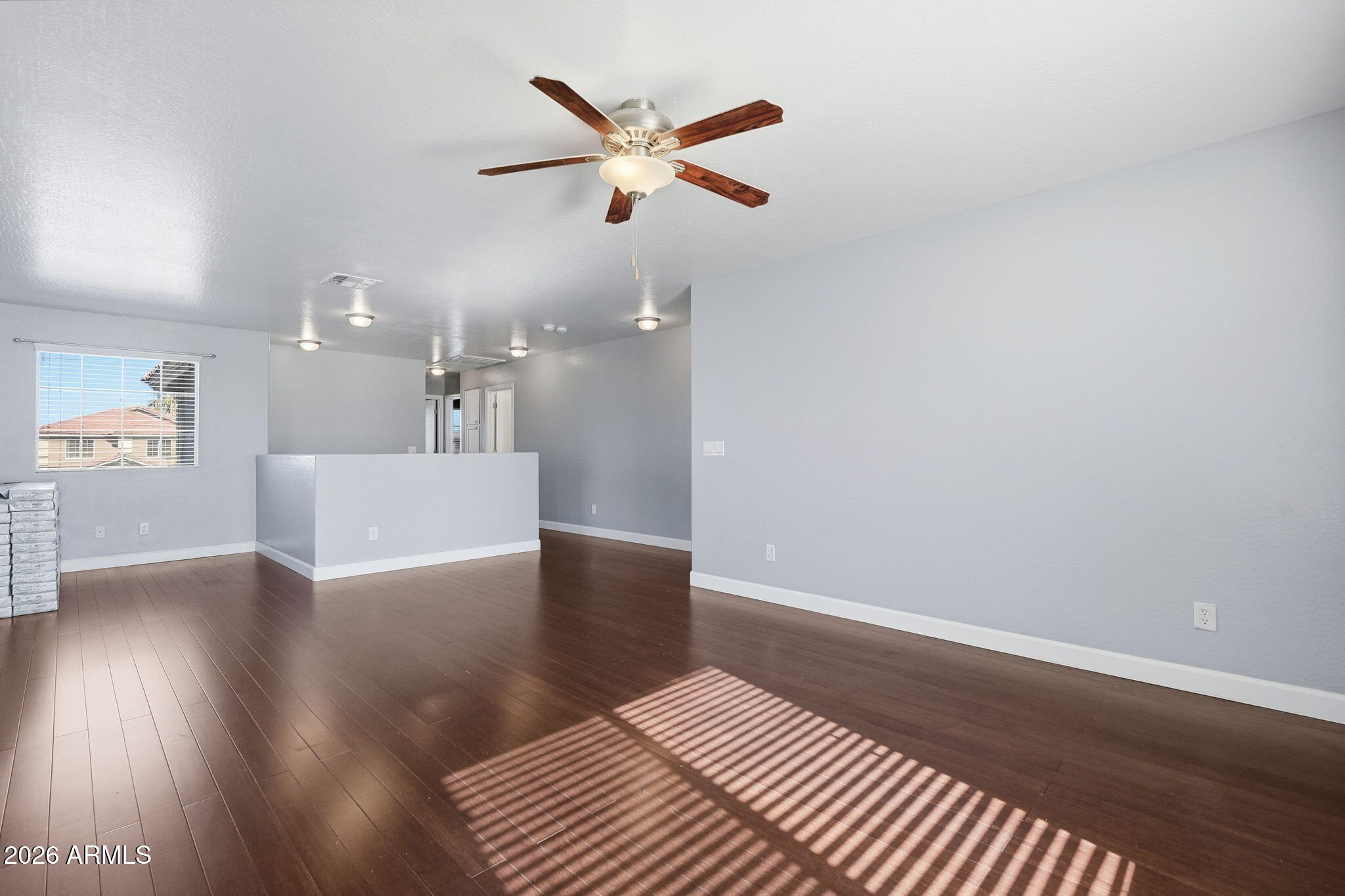 1707 West Harding Avenue Coolidge, AZ 85128 - Photo 26 of 53 a view of a livingroom with a ceiling fan and wooden floor