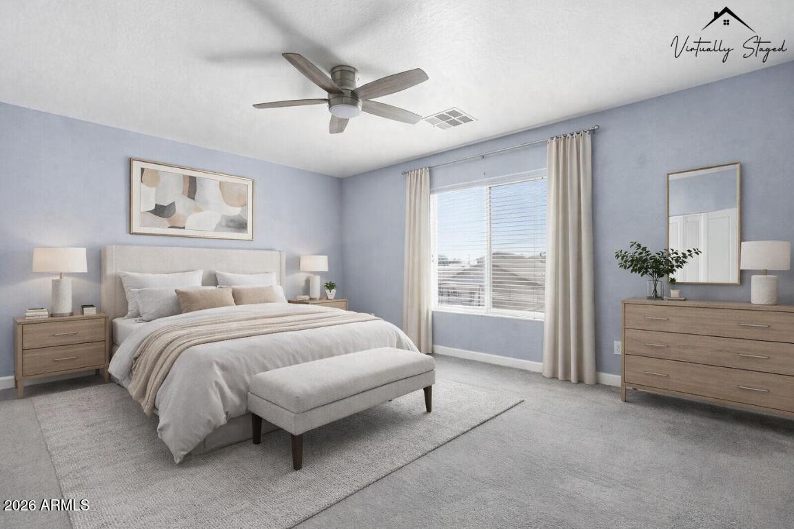 1707 West Harding Avenue Coolidge, AZ 85128 - Photo 27 of 53 a spacious bedroom with a large bed and a chandelier