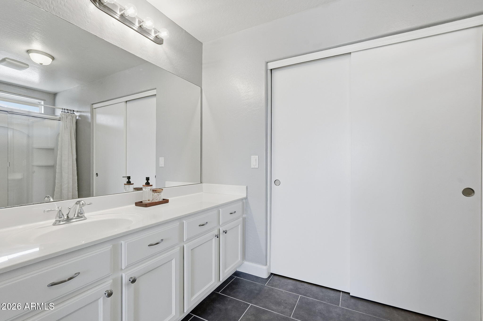 1707 West Harding Avenue Coolidge, AZ 85128 - Photo 32 of 53 a bathroom with a granite countertop sink and a mirror