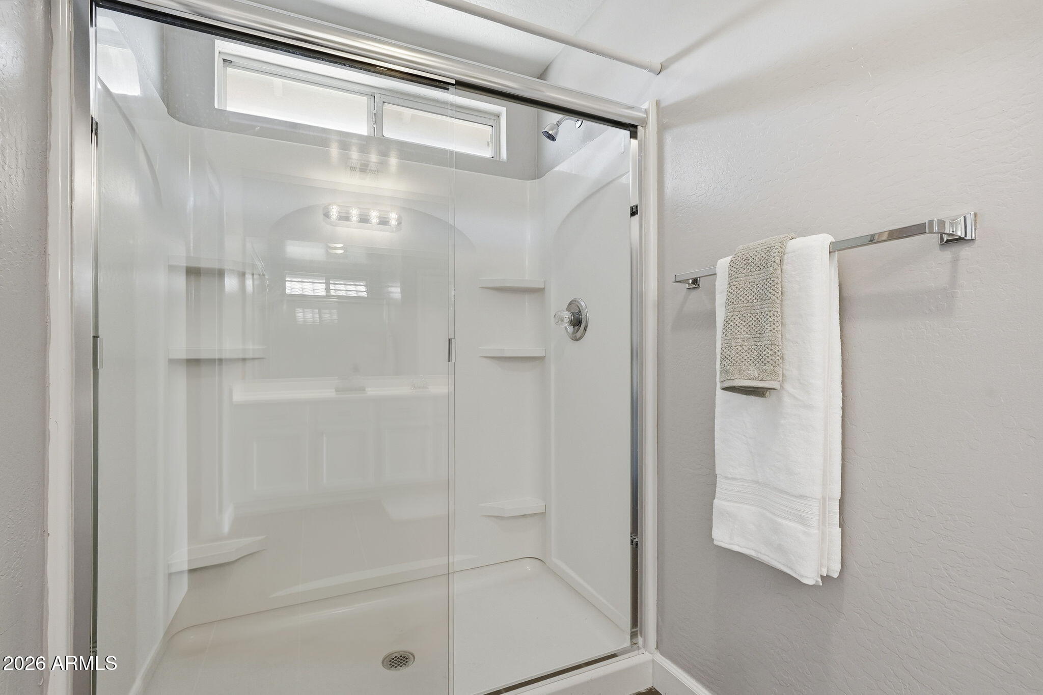 1707 West Harding Avenue Coolidge, AZ 85128 - Photo 33 of 53 a bathroom with a glass shower door