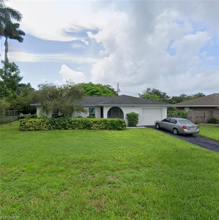 2147 51st Terrace Southwest Naples, FL 34116 - Photo 1 of 1 Single story home with a garage and a front lawn