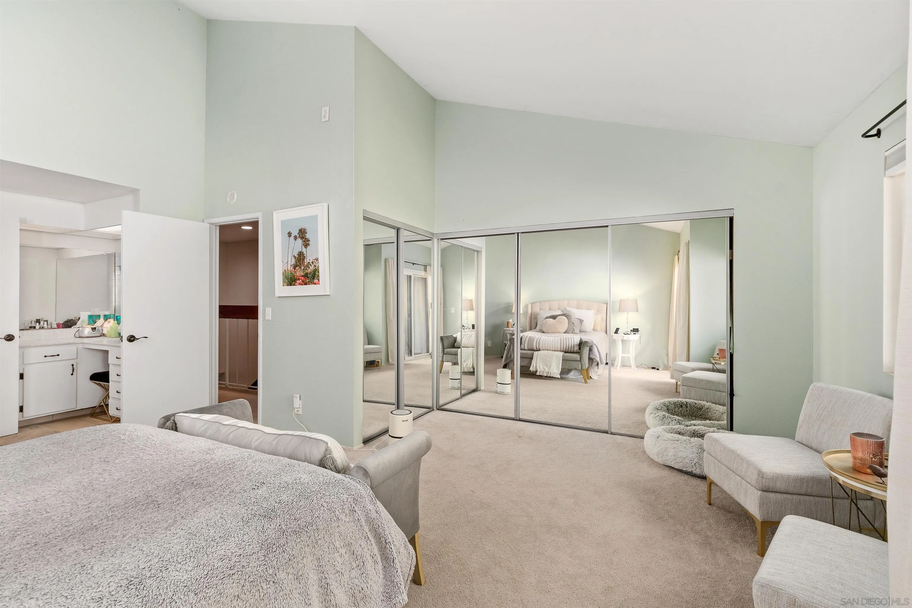 8366 Via Sonoma, Unit D La Jolla, CA 92037 - Photo 25 of 43 a bedroom with furniture and white doors