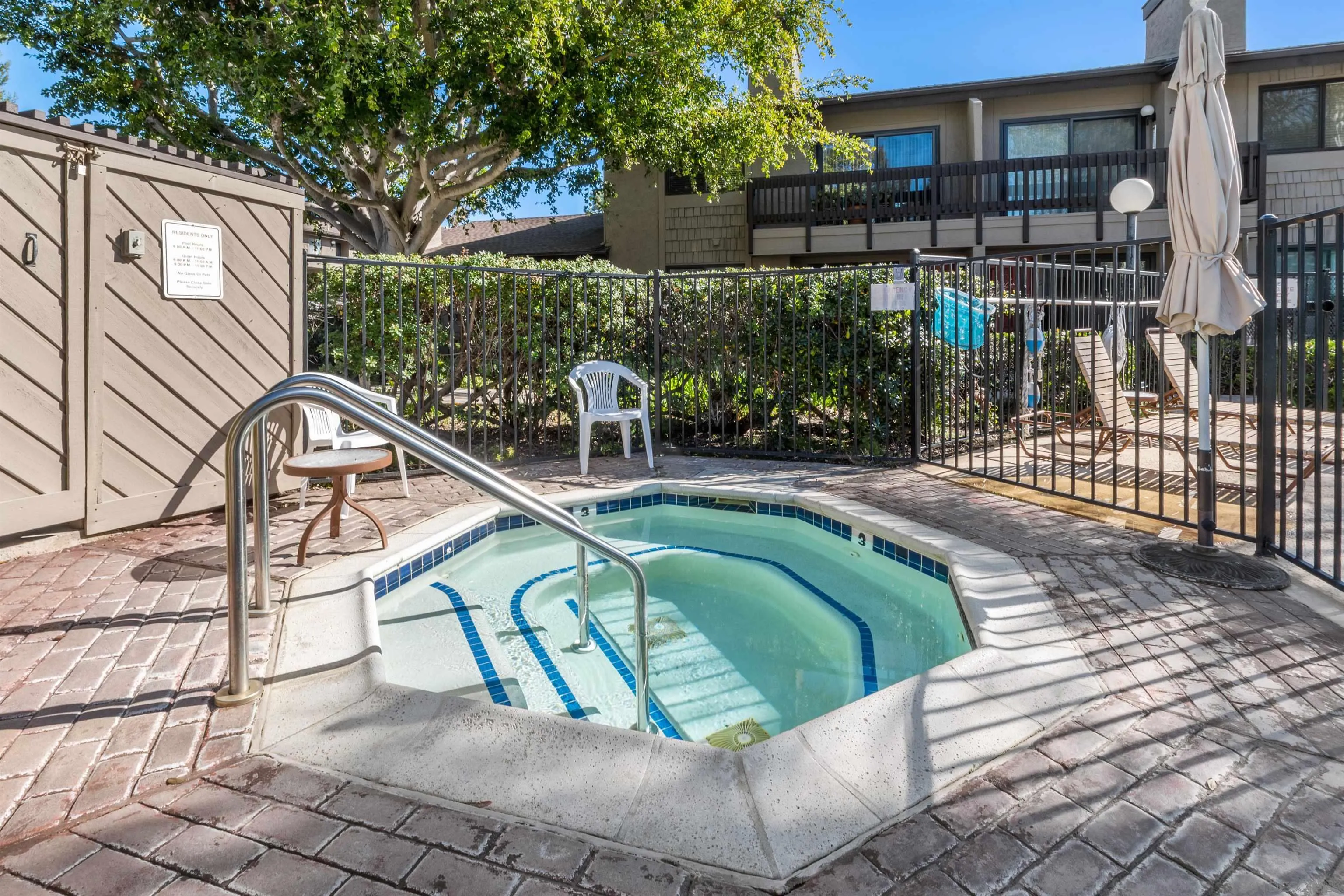 8366 Via Sonoma, Unit D La Jolla, CA 92037 - Photo 39 of 43 a view of a swimming pool with a patio