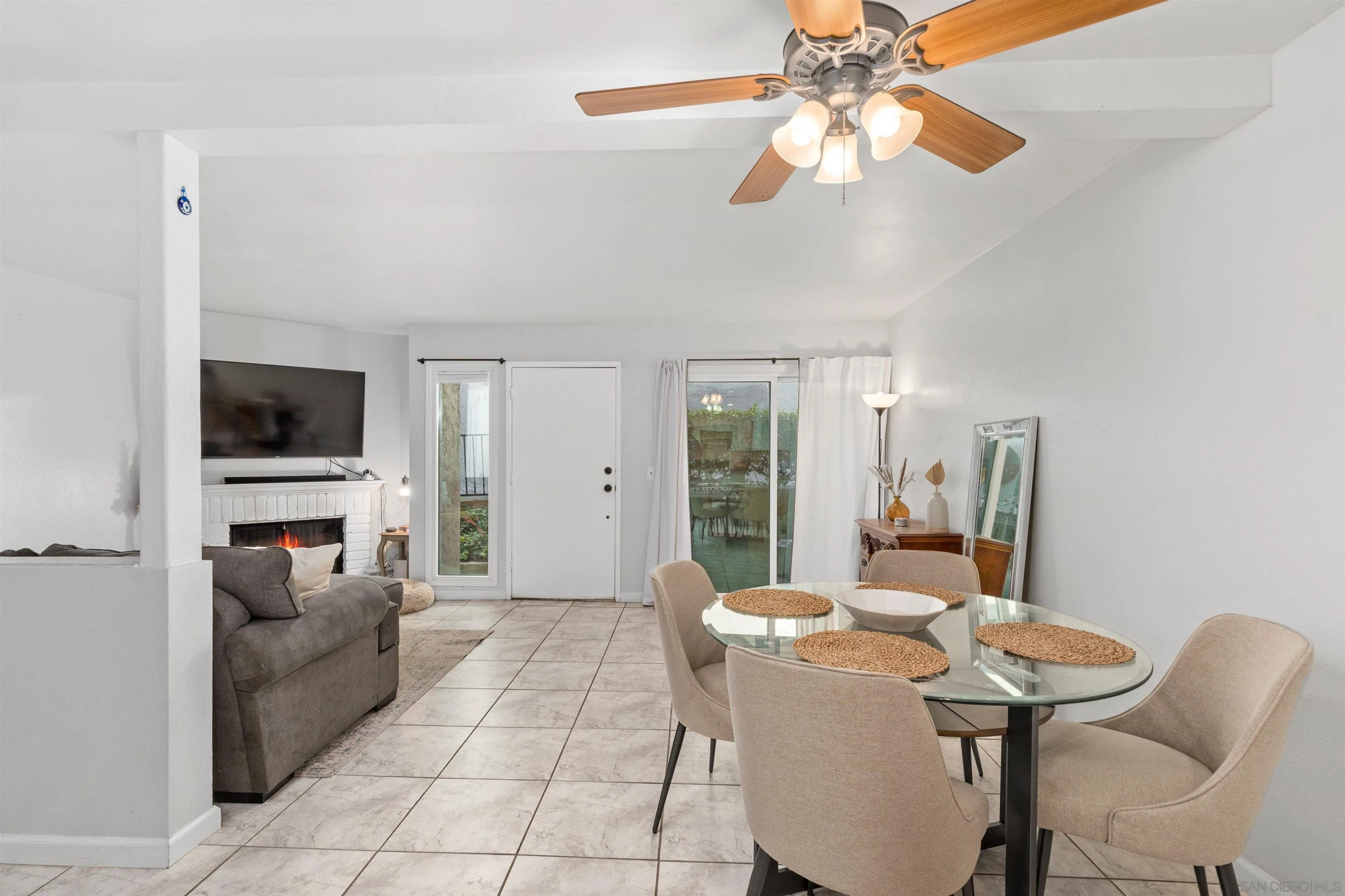 8366 Via Sonoma, Unit D La Jolla, CA 92037 - Photo 10 of 43 a view of a livingroom with furniture and a flat screen tv