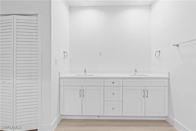 a view of room with white cabinets