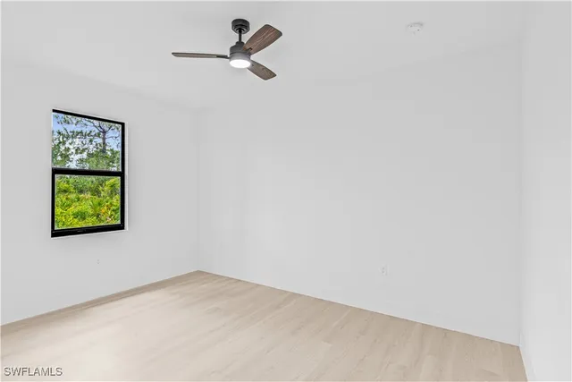 a view of empty room with windows