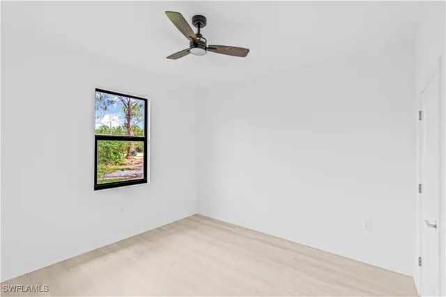 a view of empty room with windows