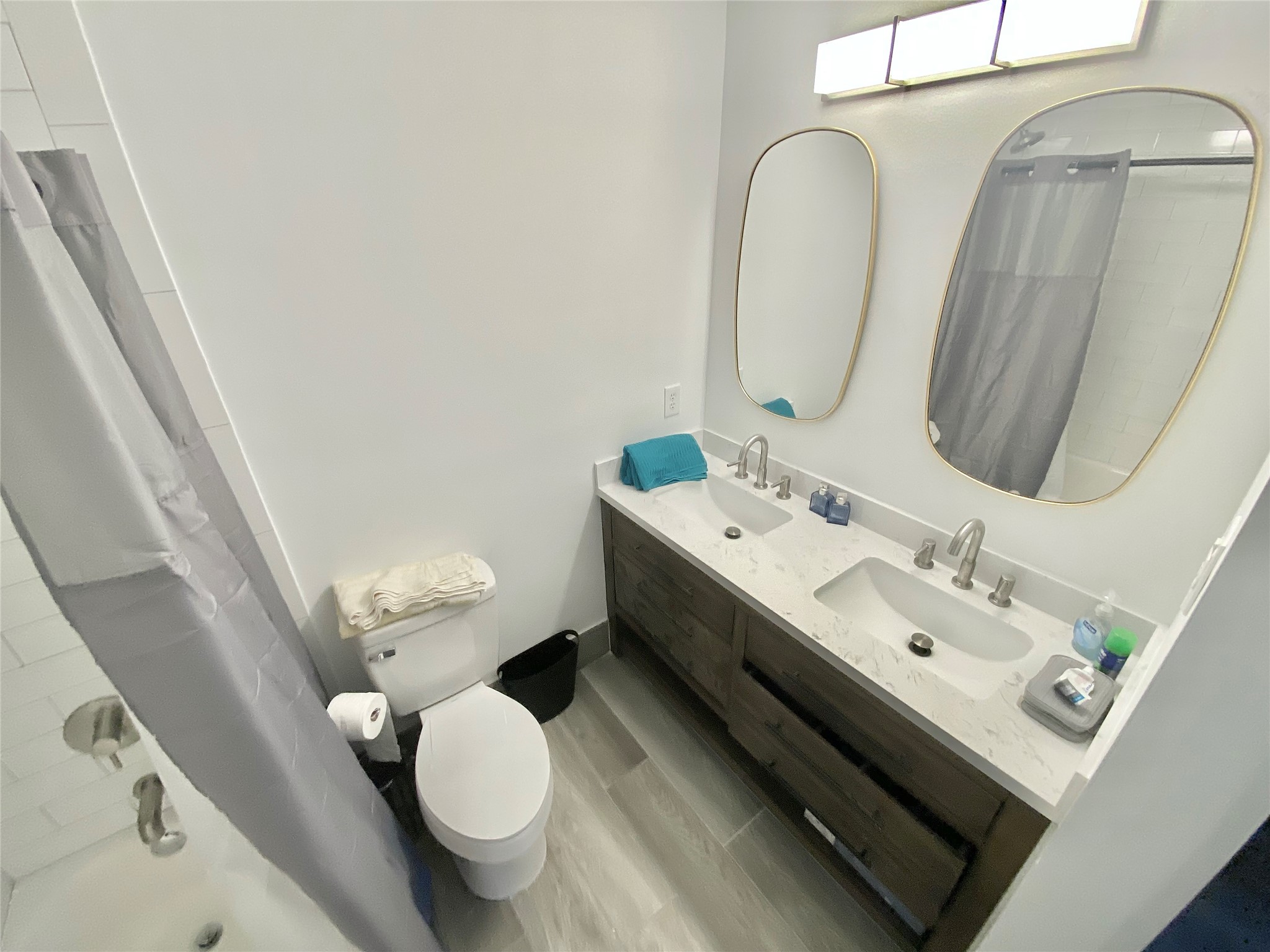 412 Pacific Street, Unit 9E Houston, TX 77006 - Photo 11 of 11 a bathroom with a double vanity sink mirror and toilet